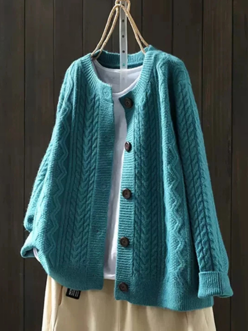 JOANNE | Cable knit sleeves, buttons down the front