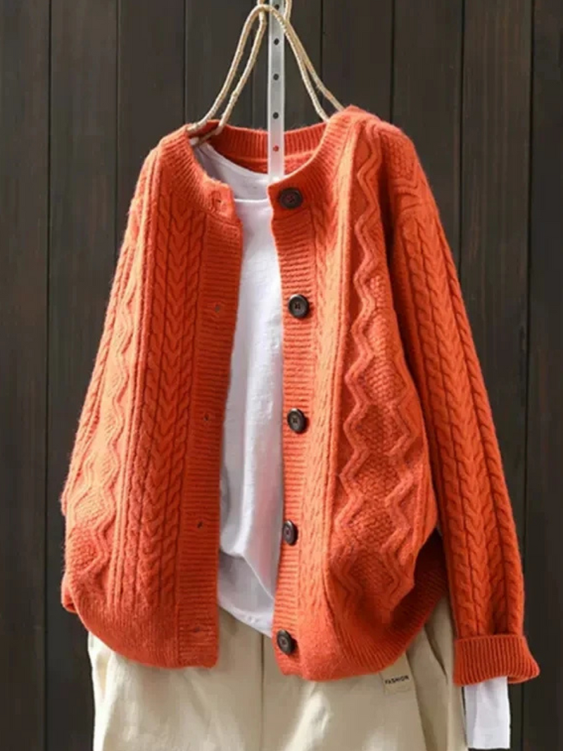 JOANNE | Cable knit sleeves, buttons down the front