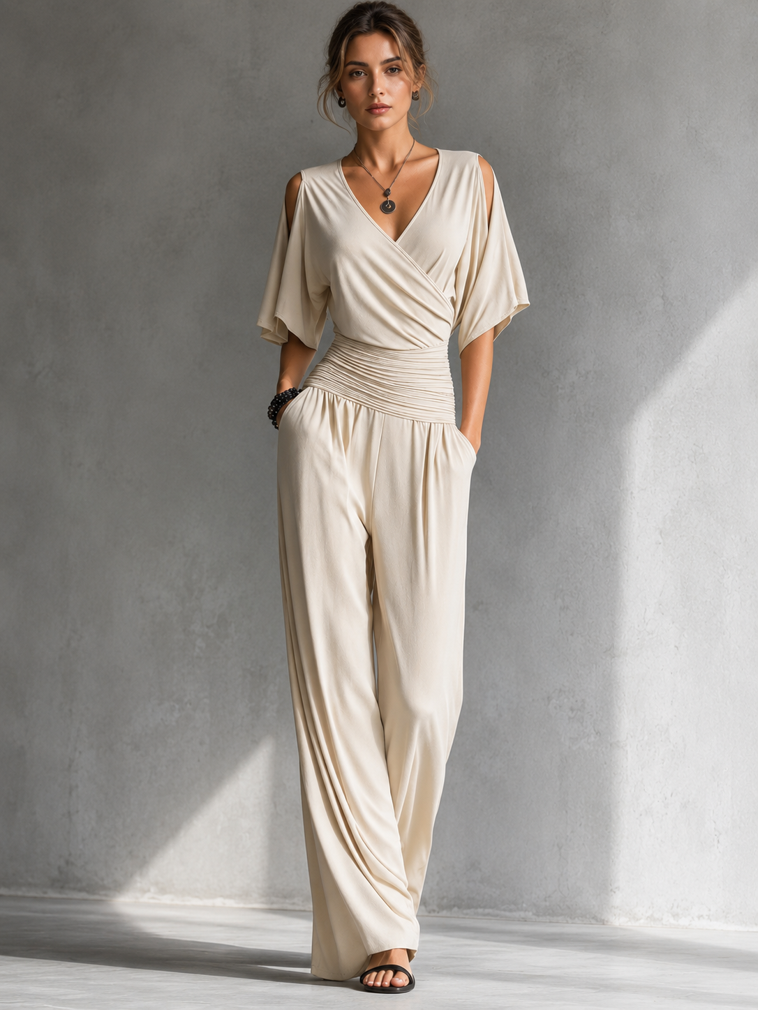 GERALDINE | Wrap-front jumpsuit with a tie waist