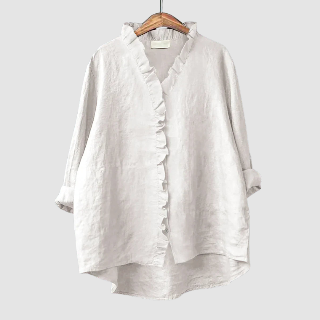 EUGENIA | Ruffle trim blouse with a high low hem