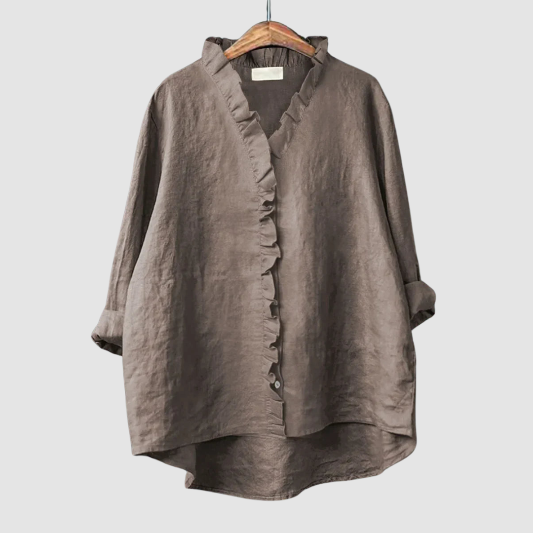 EUGENIA | Ruffle trim blouse with a high low hem