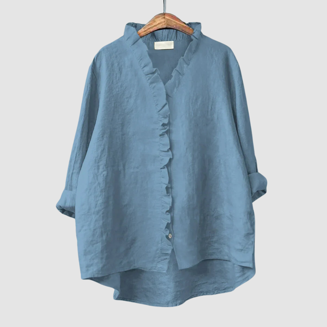EUGENIA | Ruffle trim blouse with a high low hem